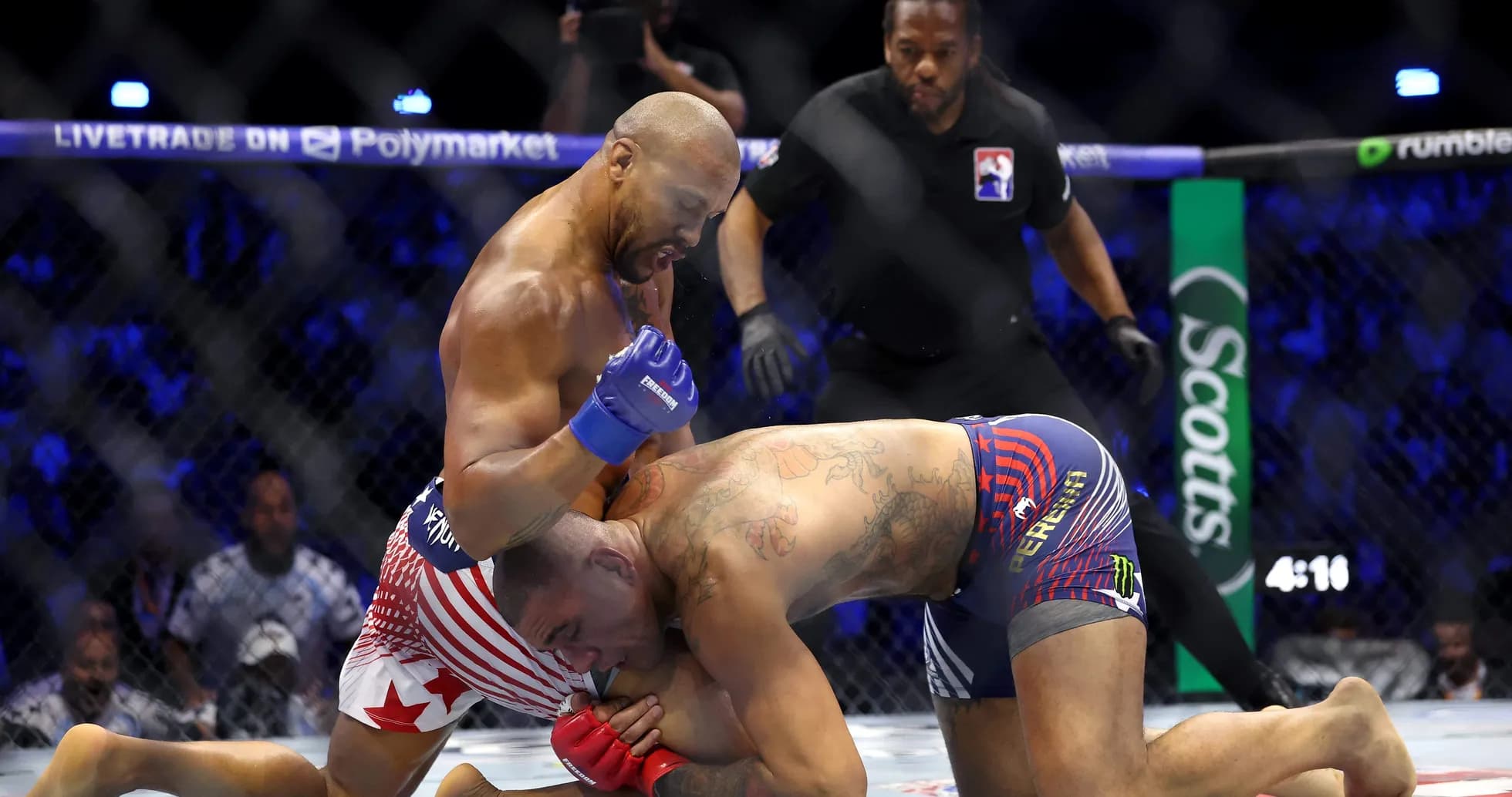 Fighters grappling in MMA match inside the cage Fighters grappling in MMA match inside the cage