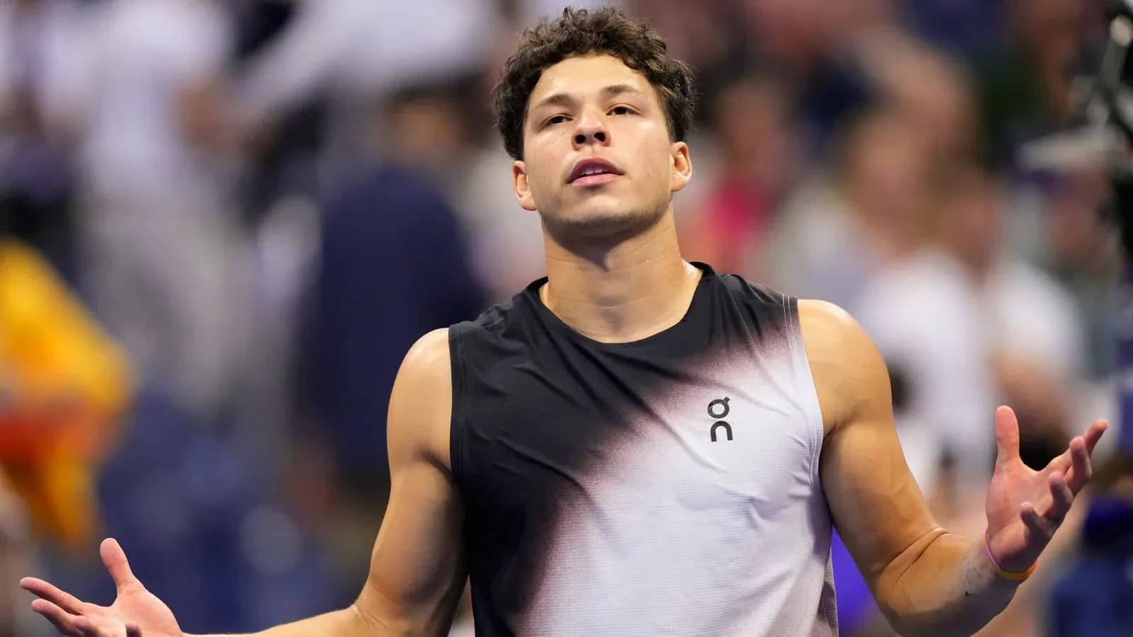 Tennis player gesturing during a match Tennis player gesturing during a match