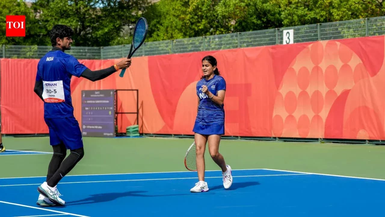 Two tennis players celebrating on the court Two tennis players celebrating on the court