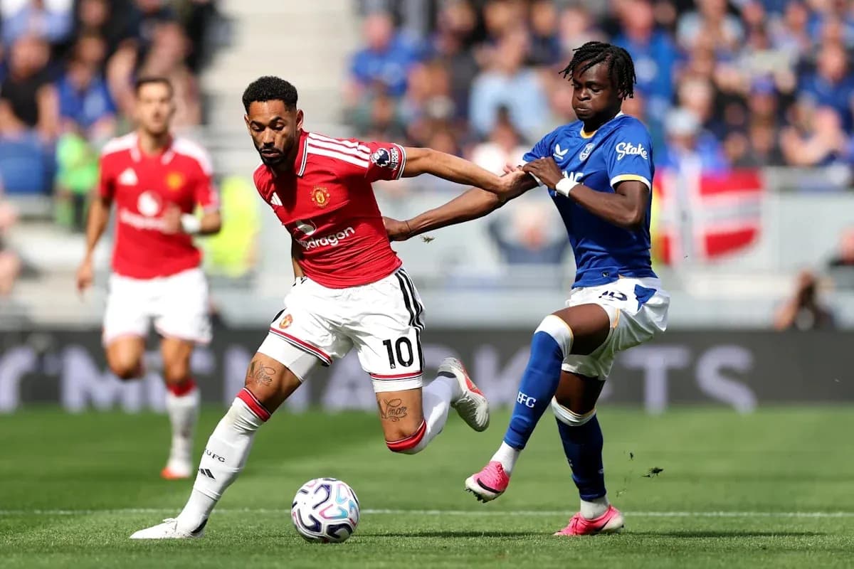 Player dribbling while being challenged by opponent Player dribbling while being challenged by opponent