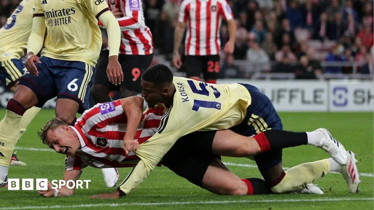 Players competing on the ground during a match Players competing on the ground during a match
