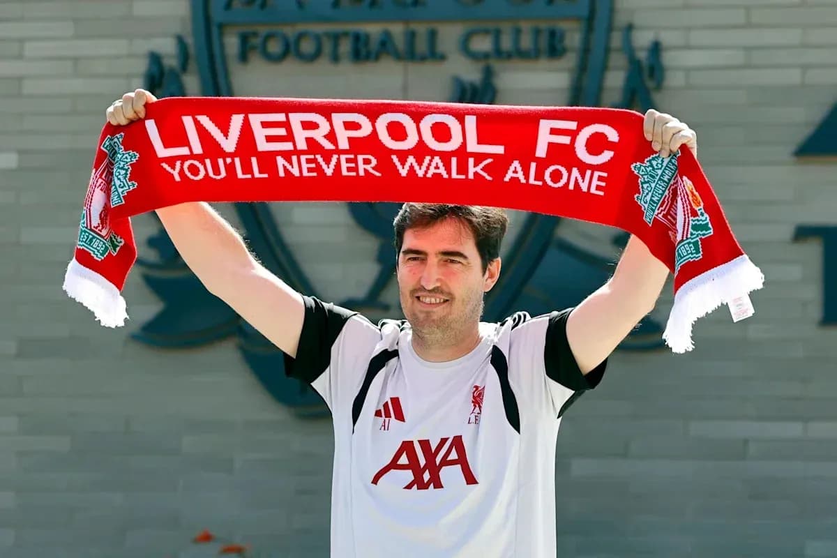 Person holding Liverpool FC scarf at club venue Person holding Liverpool FC scarf at club venue