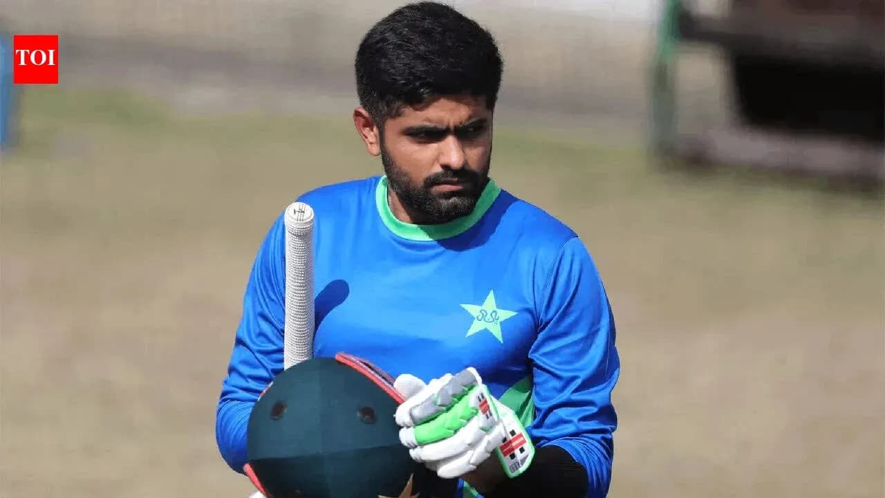 Batter holding a cricket bat during practice session Batter holding a cricket bat during practice session