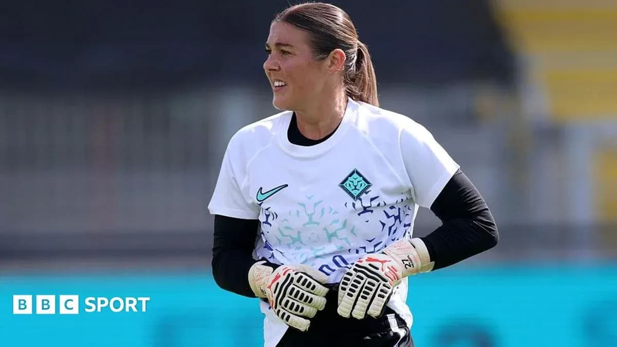 Goalkeeper in training session wearing gloves Goalkeeper in training session wearing gloves