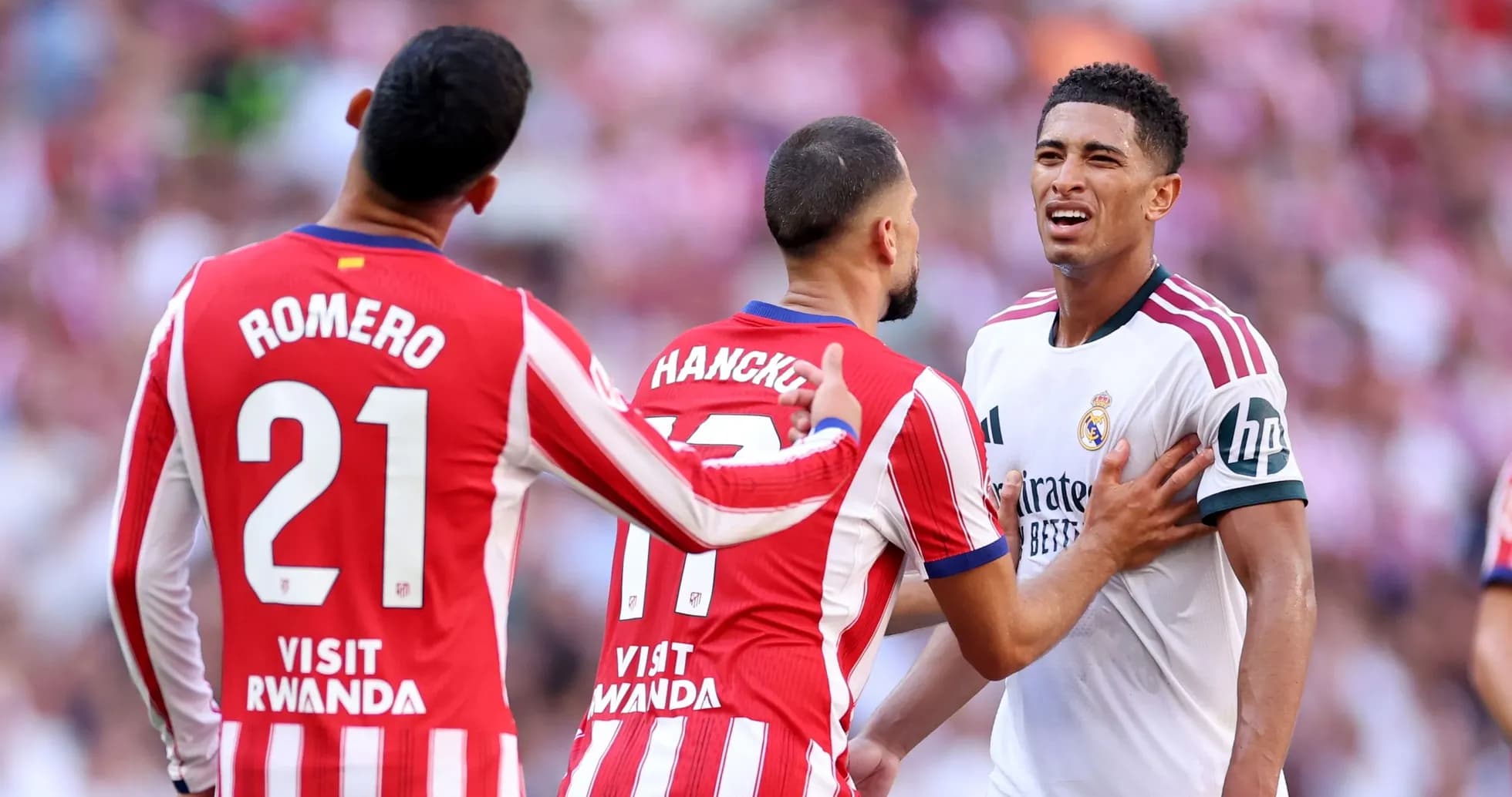 Atletico Madrid players confronting Real Madrid player Atletico Madrid players confronting Real Madrid player