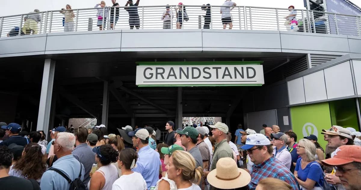 Crowd gathered at entrance to Grandstand area Crowd gathered at entrance to Grandstand area