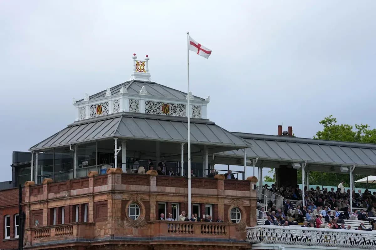 Spectators watching from the pavilion at Lord's cricket ground Spectators watching from the pavilion at Lord's cricket ground
