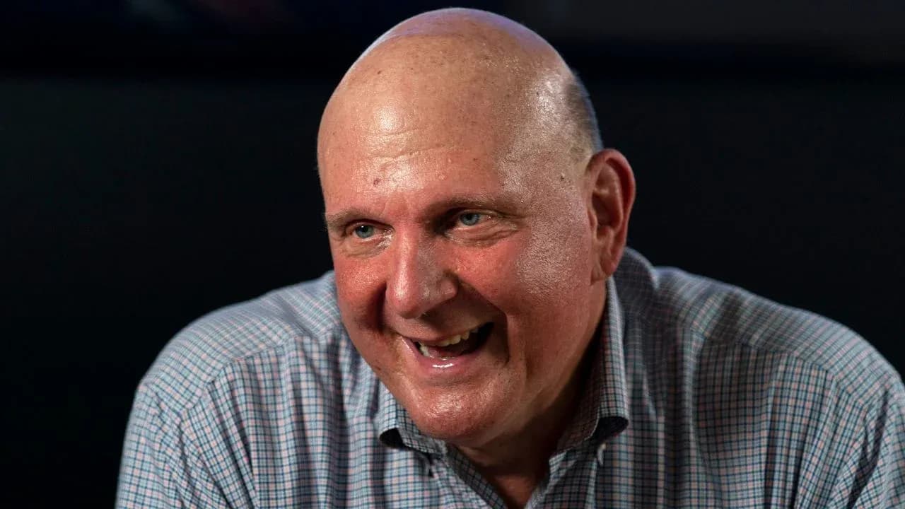 Man smiling while sitting at a table Man smiling while sitting at a table