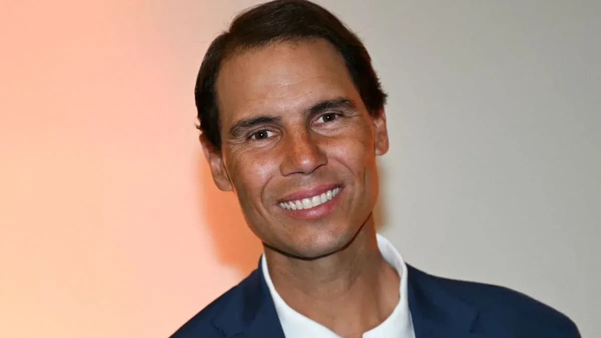 Man smiling in a suit against a light background Man smiling in a suit against a light background