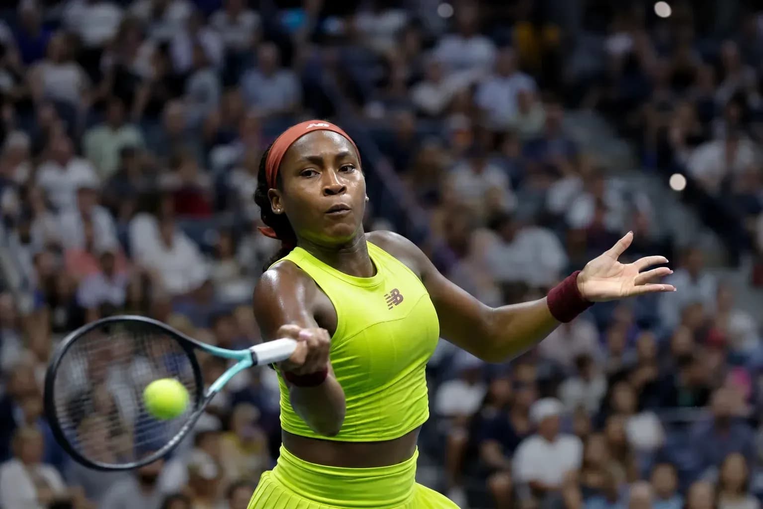 Coco Gauff returning a serve during a match Coco Gauff returning a serve during a match