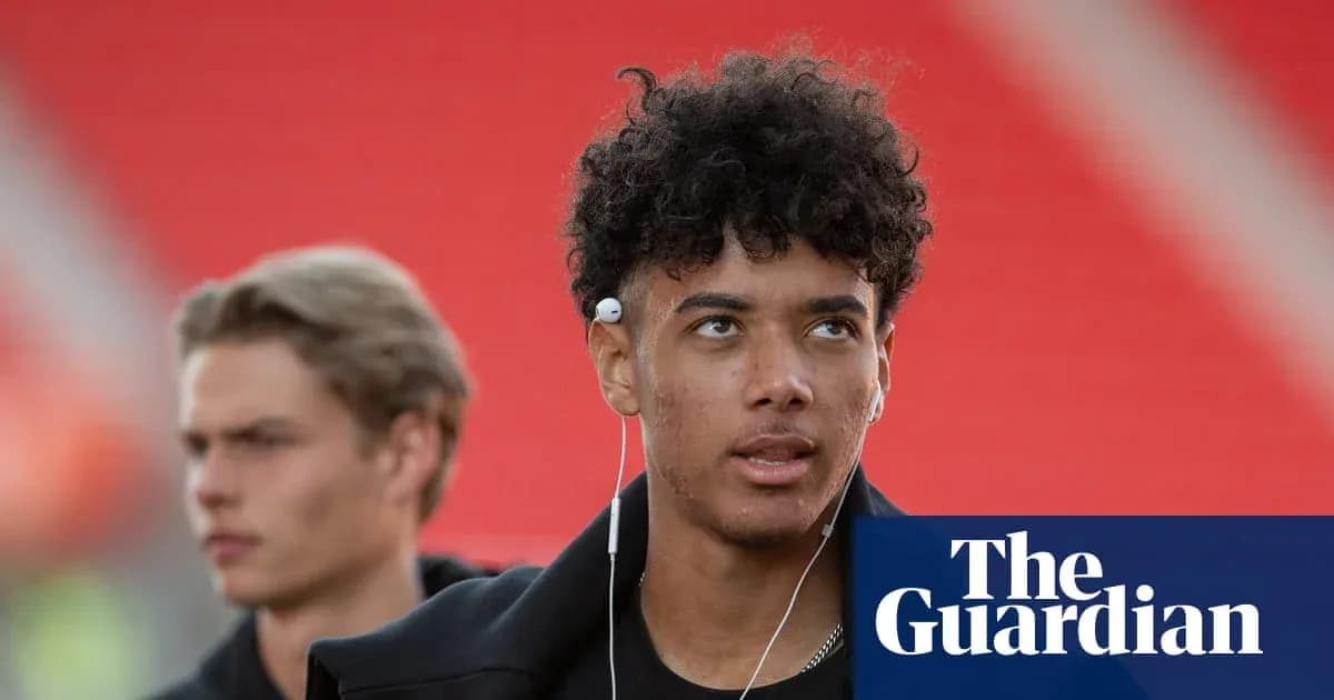 Two young men walking with earbuds before match Two young men walking with earbuds before match