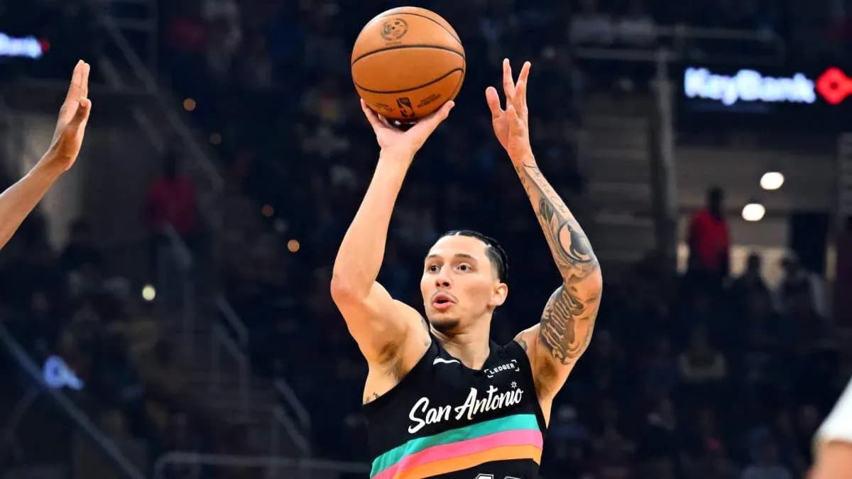 Player shooting a basketball during a game Player shooting a basketball during a game
