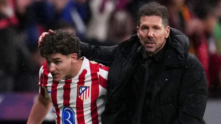 Atletico Madrid player being assisted by coach Atletico Madrid player being assisted by coach