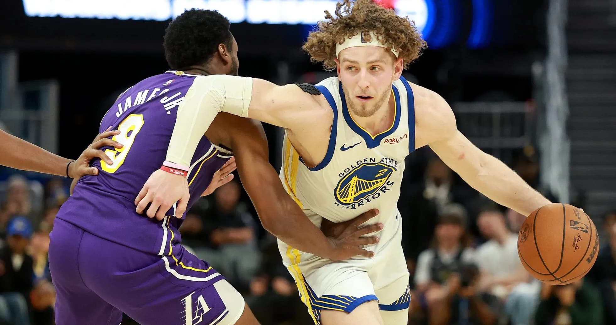 Player dribbling basketball while being guarded Player dribbling basketball while being guarded