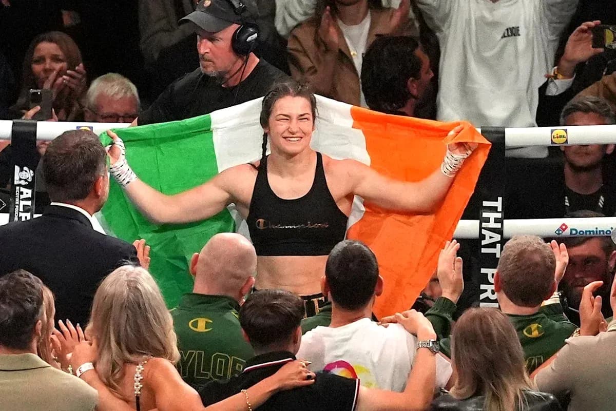 Female boxer celebrating with Irish flag after match Female boxer celebrating with Irish flag after match