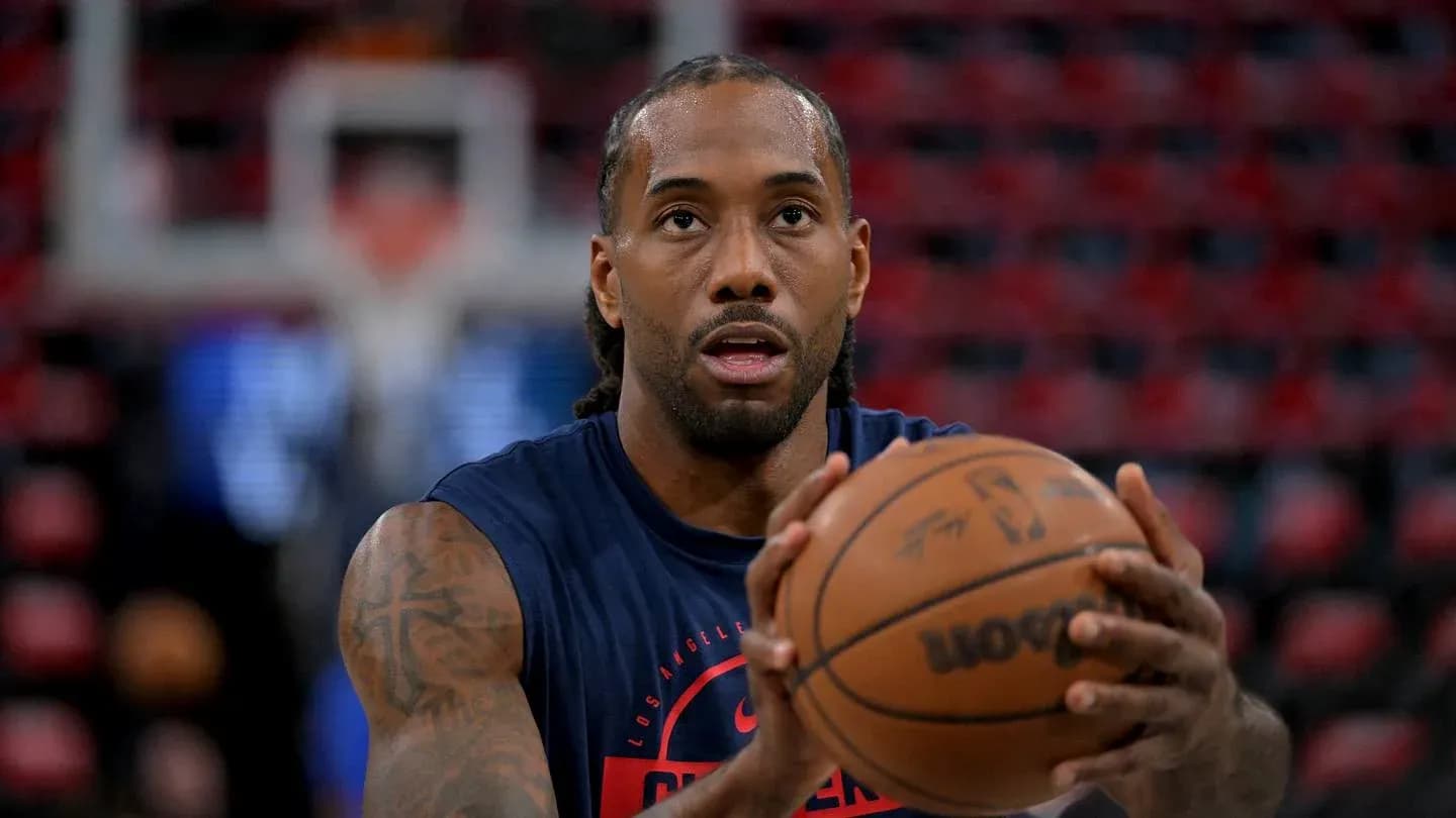 Player practicing shooting with basketball before game Player practicing shooting with basketball before game