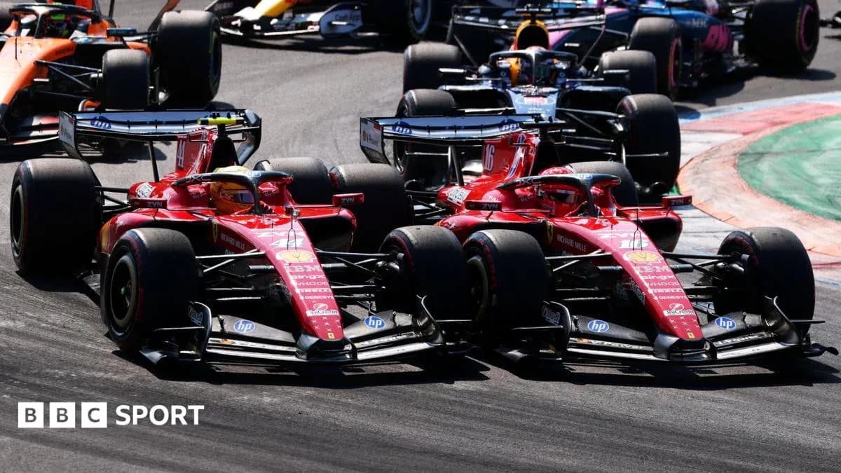 Two Ferrari cars racing closely on track Two Ferrari cars racing closely on track