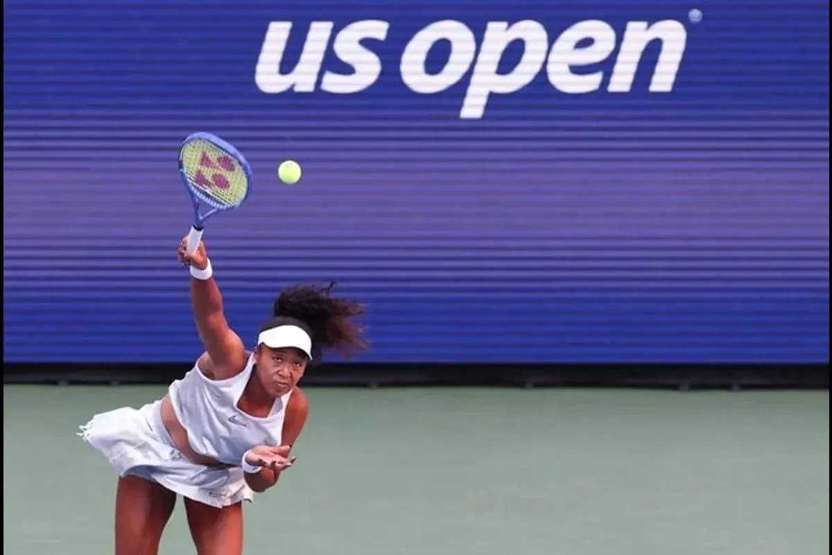 Player serving during US Open tennis match Player serving during US Open tennis match