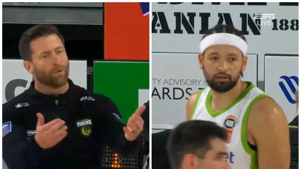 Coach discussing with player during basketball game Coach discussing with player during basketball game