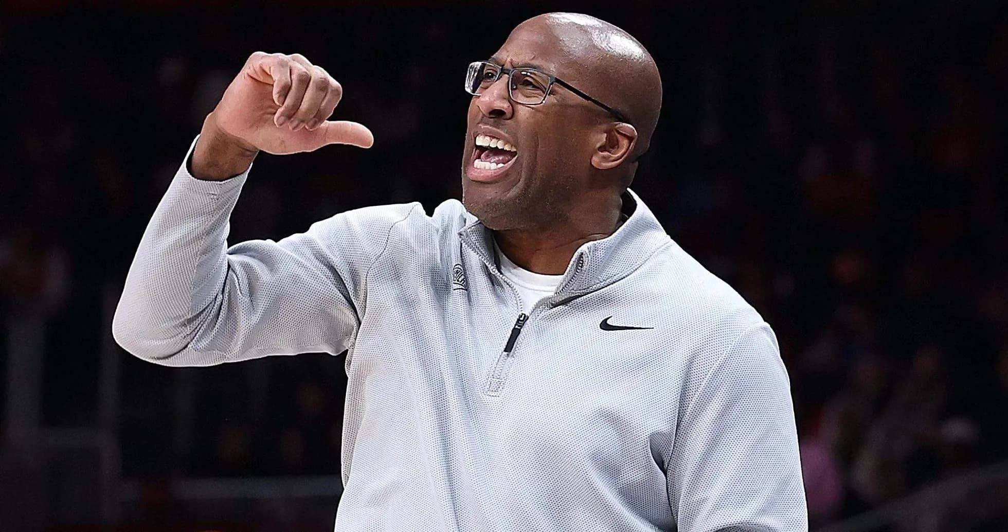 Coach gesturing emphatically during a basketball game Coach gesturing emphatically during a basketball game