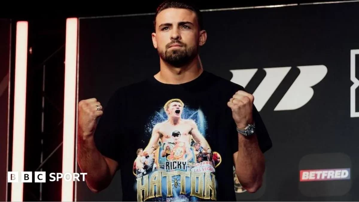Boxer posing with clenched fists at event Boxer posing with clenched fists at event