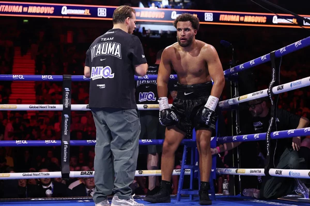 Boxer receiving instructions from coach in corner Boxer receiving instructions from coach in corner