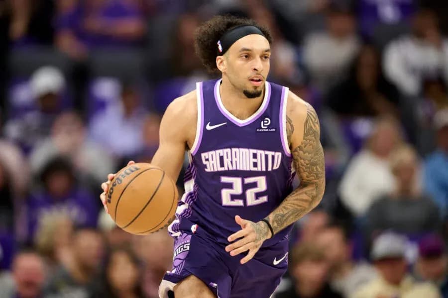 Player dribbling basketball during game for Sacramento Player dribbling basketball during game for Sacramento