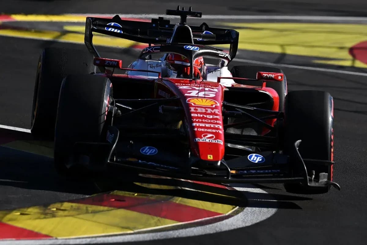Ferrari Formula 1 car navigating a racetrack corner Ferrari Formula 1 car navigating a racetrack corner