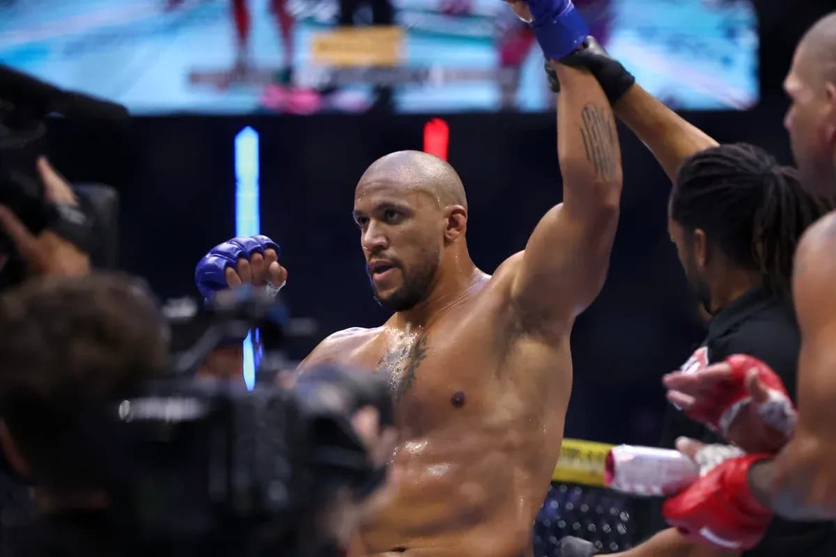 Fighter celebrating victory inside the octagon Fighter celebrating victory inside the octagon