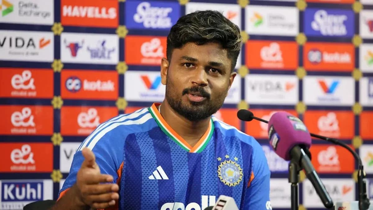 Cricketer speaking at press conference with microphone Cricketer speaking at press conference with microphone