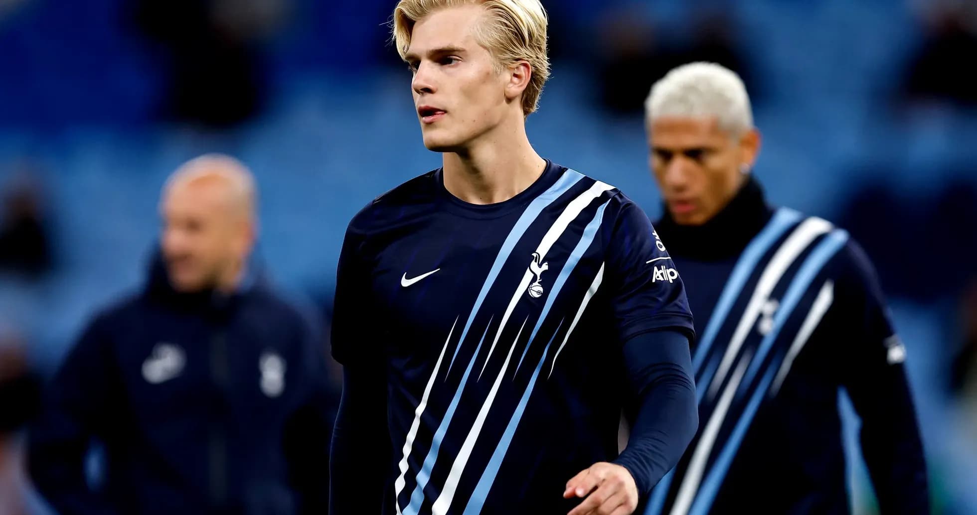 Player walking on pitch in Tottenham kit Player walking on pitch in Tottenham kit