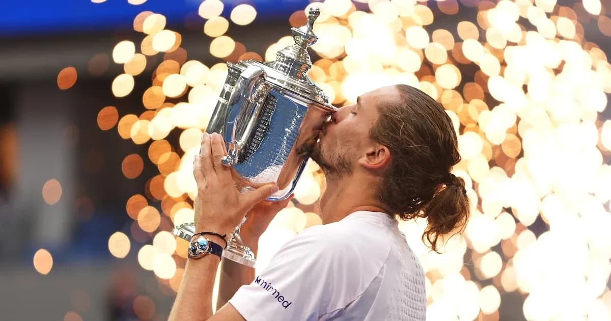Player kissing trophy with fireworks in background Player kissing trophy with fireworks in background