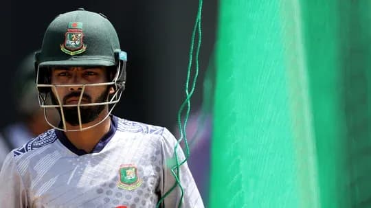 Cricketer in helmet preparing for practice session Cricketer in helmet preparing for practice session