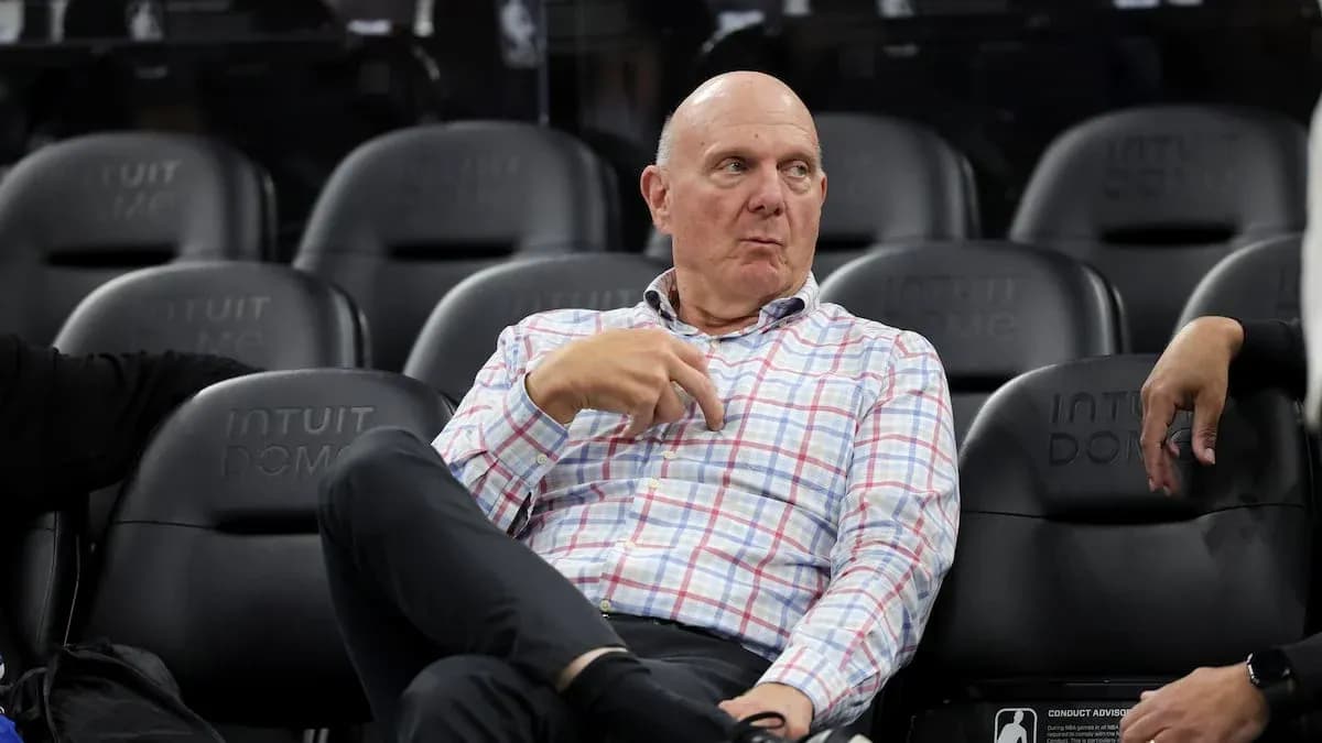 Man sitting in seats at Intuit Dome arena Man sitting in seats at Intuit Dome arena