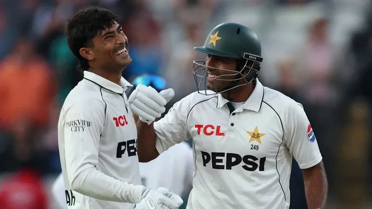 Two Pakistani cricketers celebrating on the field Two Pakistani cricketers celebrating on the field