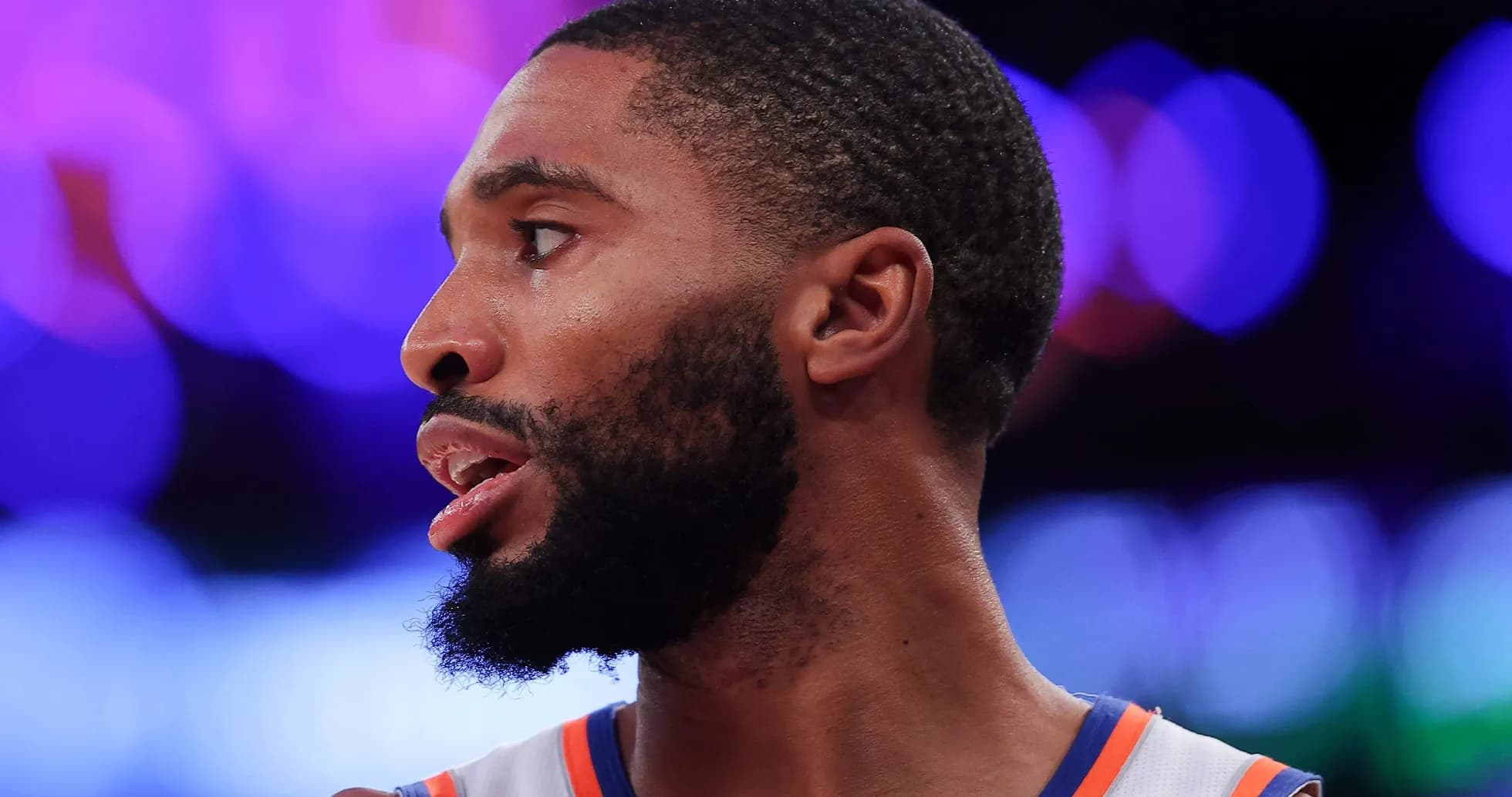 Basketball player in profile during game Basketball player in profile during game