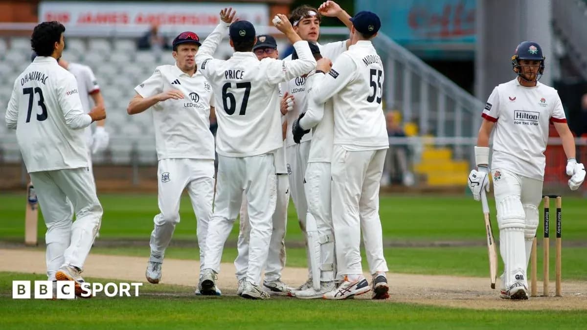 Cricket team celebrating a wicket on the field Cricket team celebrating a wicket on the field