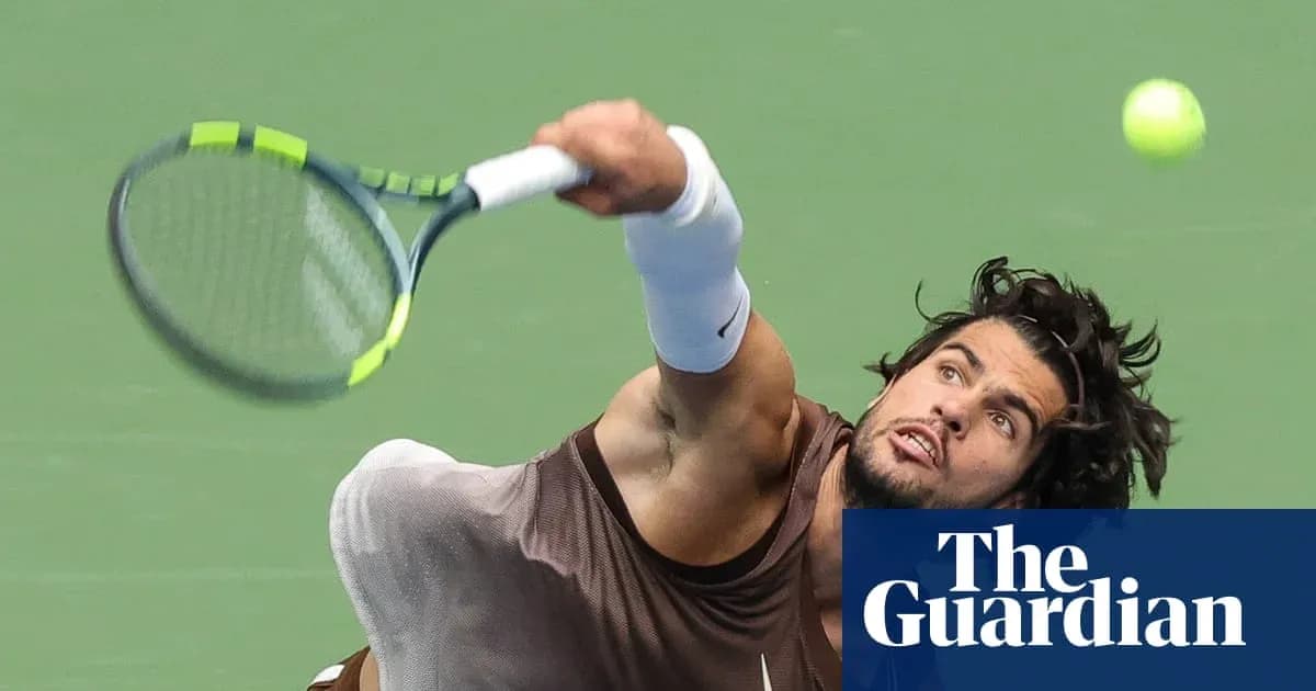 Player serving during a tennis match on court Player serving during a tennis match on court
