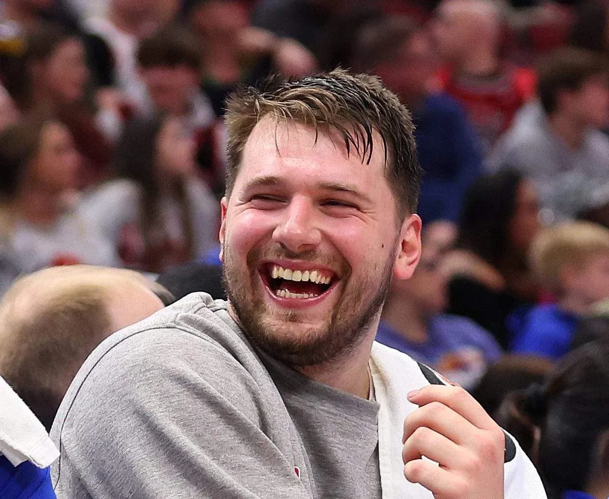 Player laughing on the sidelines during game Player laughing on the sidelines during game