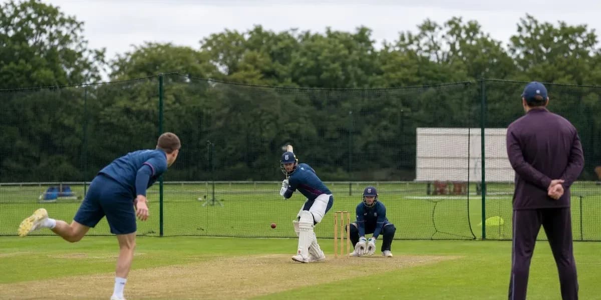 Batsman facing bowler during cricket practice session Batsman facing bowler during cricket practice session