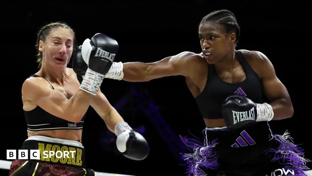Boxer delivering a punch during a match Boxer delivering a punch during a match