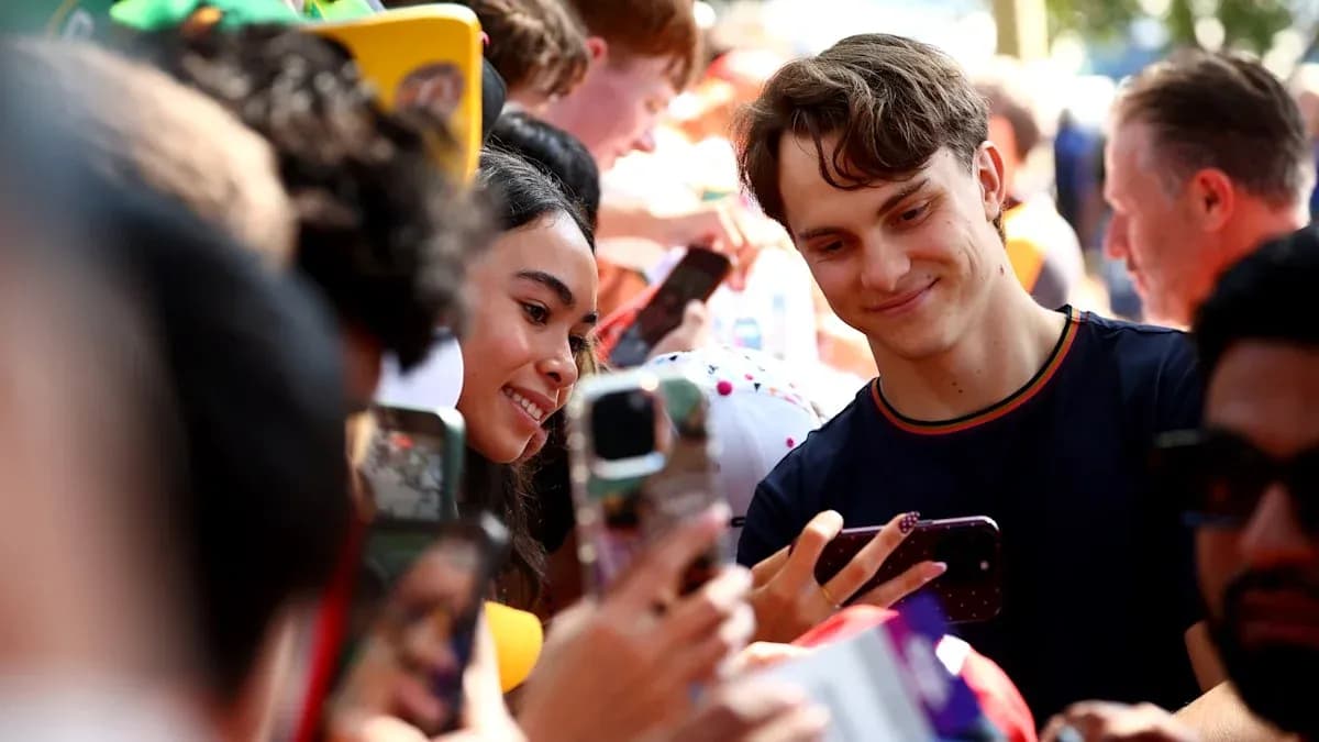 Fans taking selfies with a popular athlete Fans taking selfies with a popular athlete