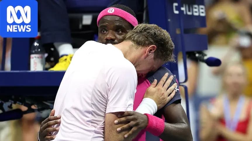 Two tennis players embracing at the court Two tennis players embracing at the court