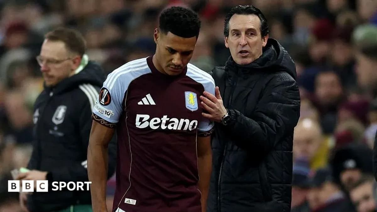 Aston Villa player receiving instructions from coach Aston Villa player receiving instructions from coach