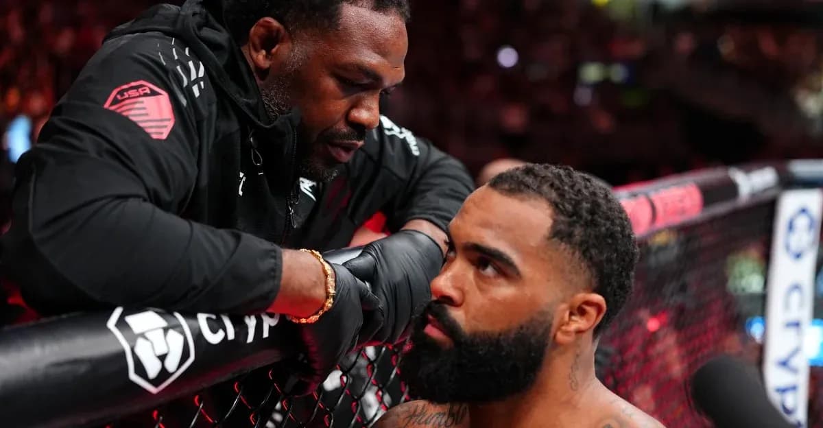 Trainer giving advice to fighter in octagon Trainer giving advice to fighter in octagon