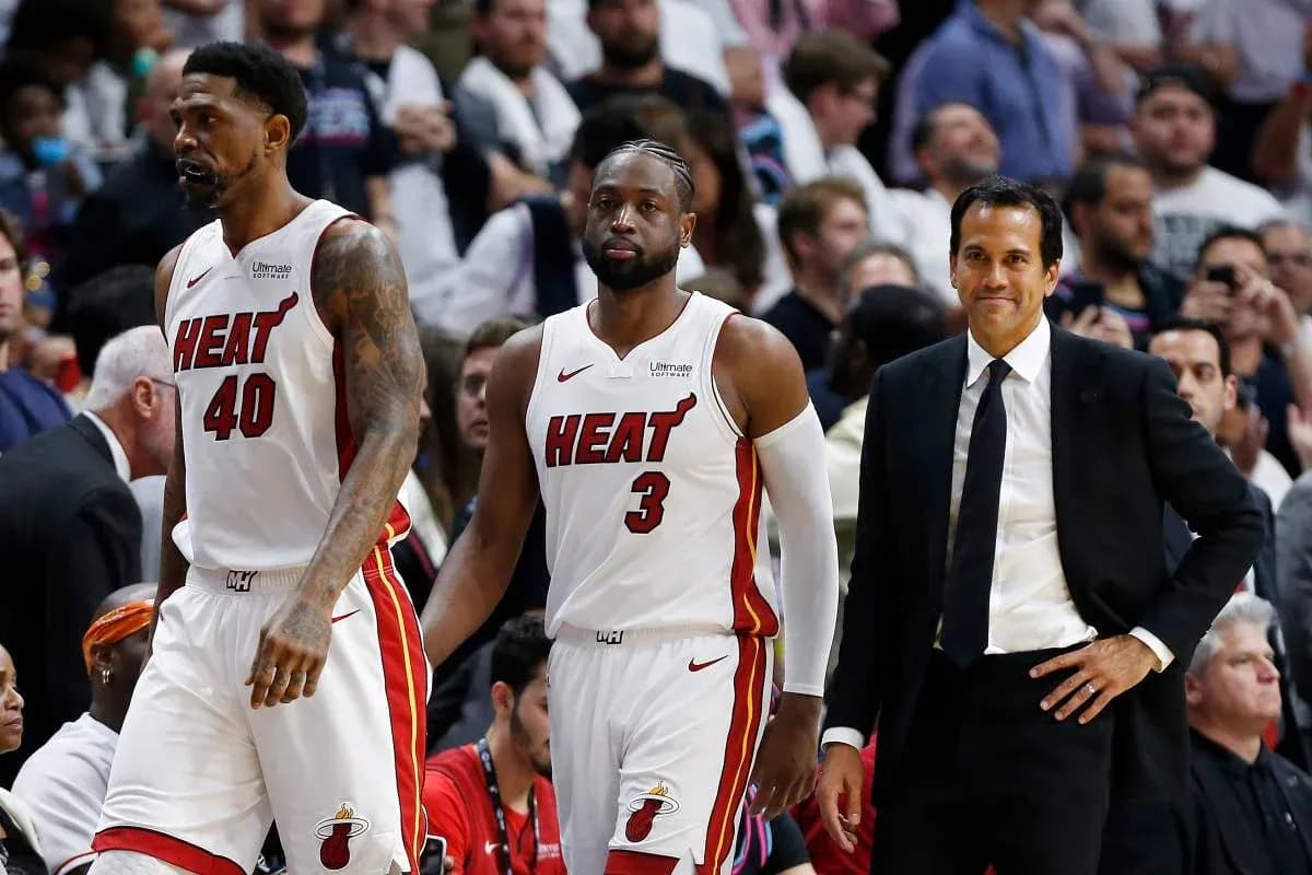 Miami Heat players and coach during game timeout Miami Heat players and coach during game timeout