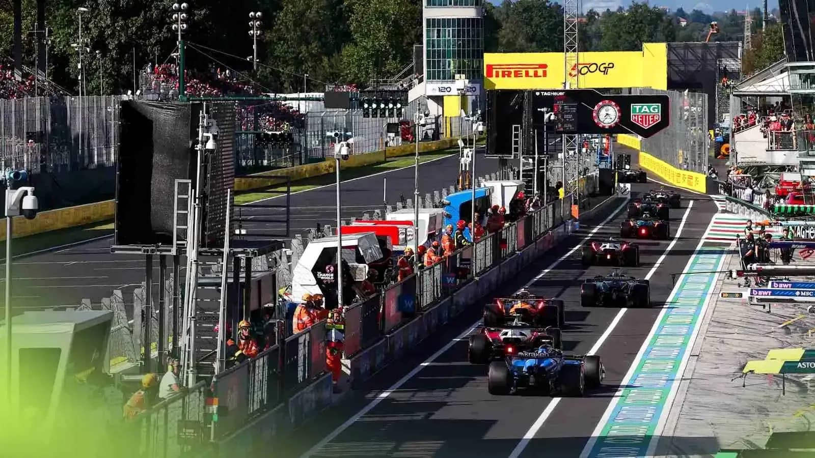 Formula 1 cars entering the pit lane during race Formula 1 cars entering the pit lane during race