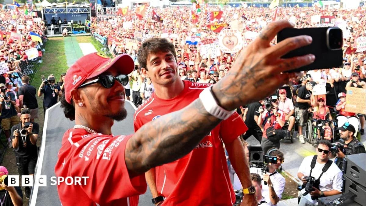 Drivers taking selfie with crowd in background Drivers taking selfie with crowd in background