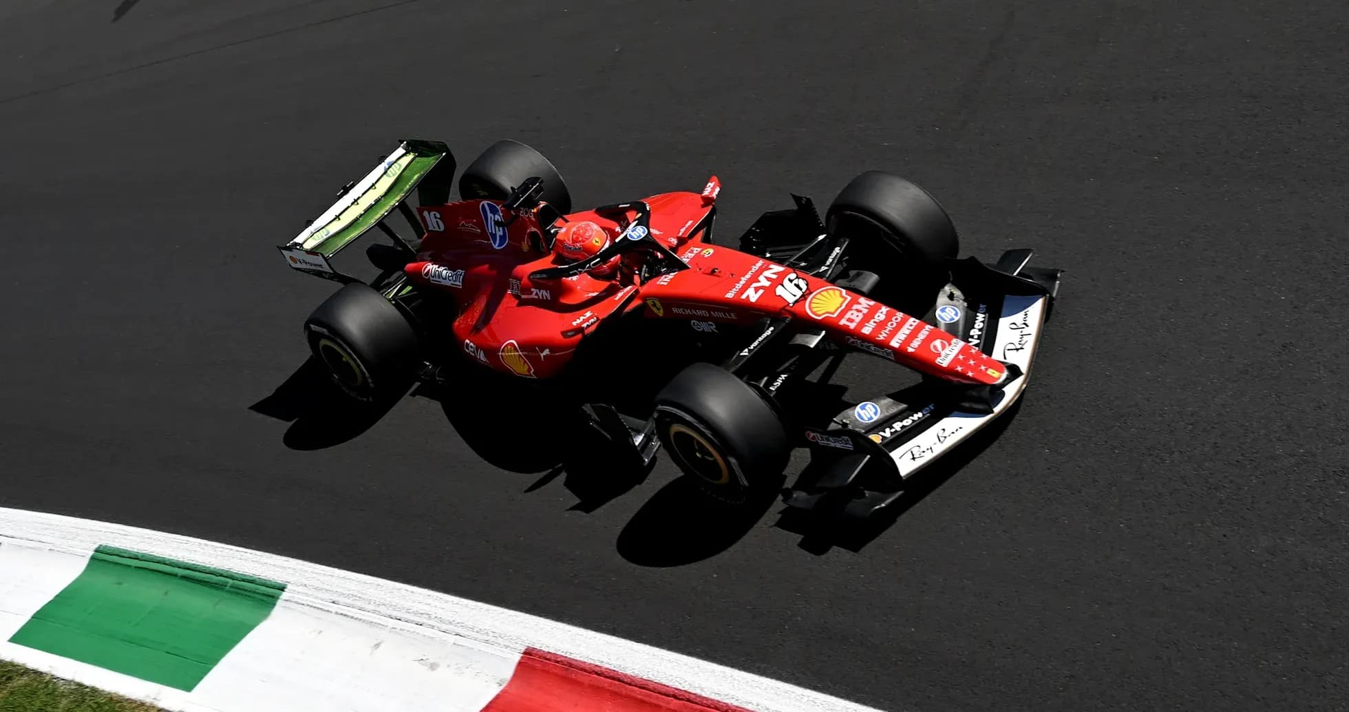 Ferrari car racing on track during Formula 1 event Ferrari car racing on track during Formula 1 event