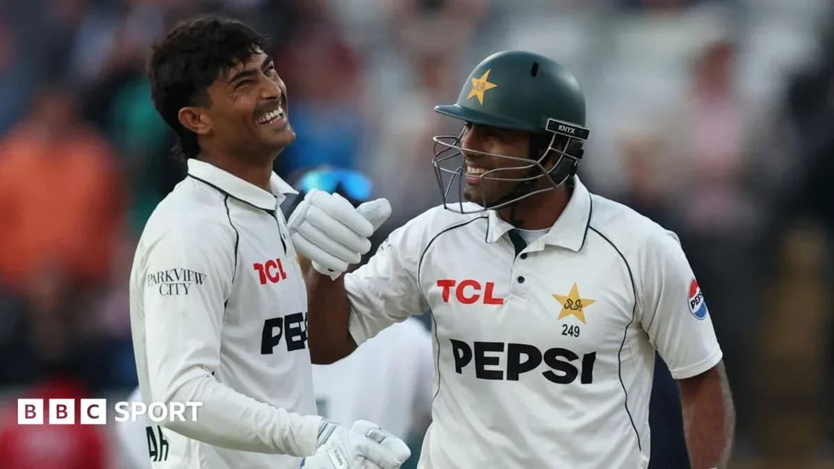 Two cricketers celebrating during a match Two cricketers celebrating during a match